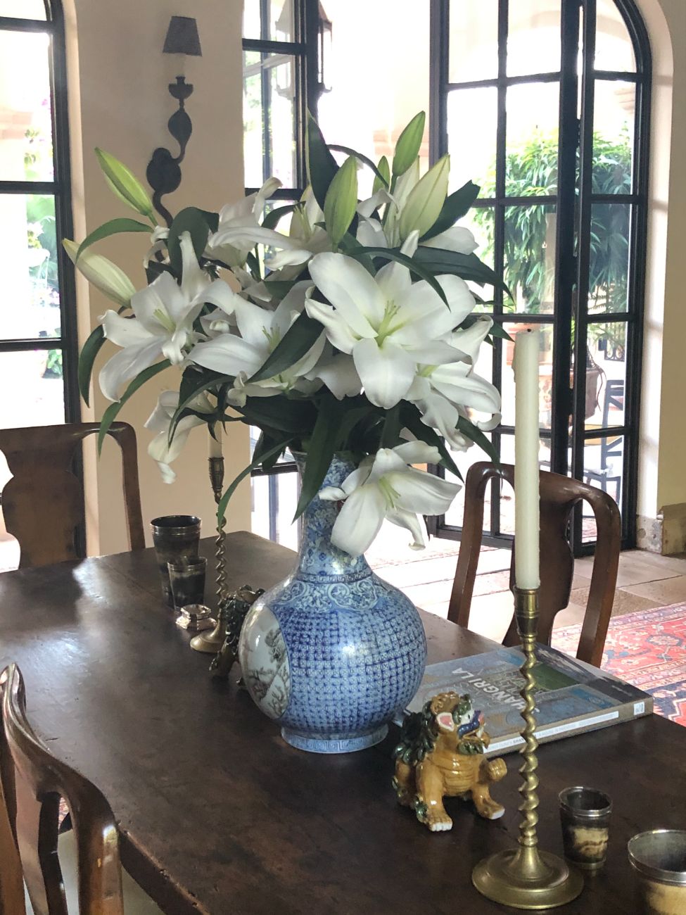 Lilies in a window, recurring flowers for Palm Beach homes